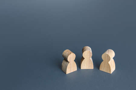 Three human figurines. Communication and discussion. Friendly relations. A meeting. Assistance,...