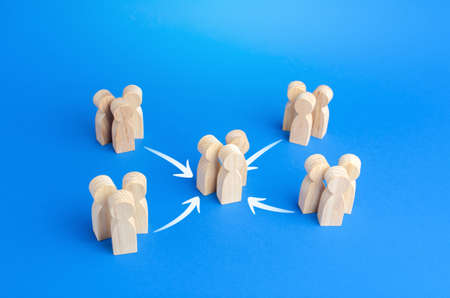 People gather in a larger group. Consolidation of efforts and growth in numbers. Cooperation, collaboration. Unity teamwork. Complication of society organization. Merging into a bigger formationの写真素材