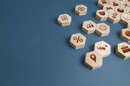 Wooden figurines with business attributes. Components for building a successful company and career...