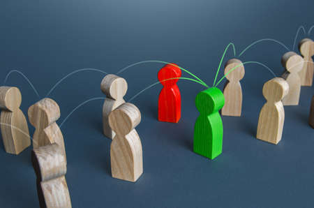 Red and green people in the corporate network. Resolution of issues and conflicts through contact managers. Concept of a reliable cooperating partner and an unreliable non-negotiable intermediaryの写真素材