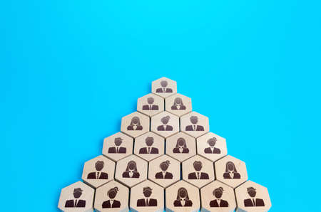 People grouped in an arrow formation. Attracting supporters, building a consolidated force. Common interest, problem solving. Team, teamwork cooperation. Unity joining. Business company hierarchyの写真素材