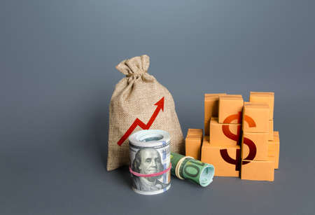 Dollar money with goods and an arrow up. Growing profits. Increasing consumption, trade balance. High sales. Economy growth. Production rise. Import export. Increase in budget revenues from taxes.の写真素材