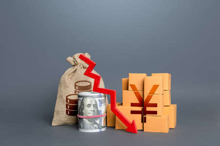 Chinese yuan or japanese yen money with goods and an arrow down. Falling profits. Reduction in...