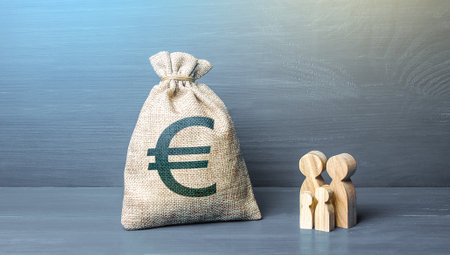 Family figurines and euro money bag. Social policy, family budget. Investment in human capital. Income, expenses. Favorable conditions for population growth. Medicine and demography. Refugees crisisの写真素材