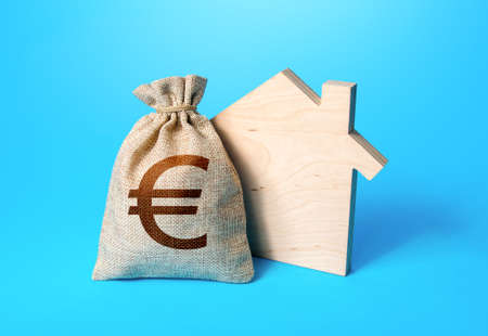 House silhouette and a euro money bag. Home purchase, investment in real estate construction. Mortgage loan. Property appraisal. Realtor services. House project development. Rental businessの写真素材