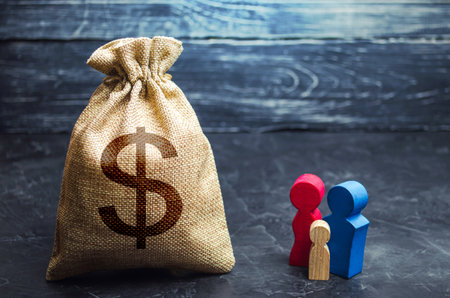 Family figurines and dollar money bag. Social assistance and support. Income level, budget. High...