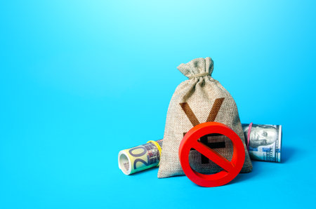 Chinese yuan or japanese yen money bag and prohibition sign NO. Monitoring of suspicious transactions. Confiscation of capital of illegal origin. Freezing of assets, seizure of savings. Sanctionsの写真素材