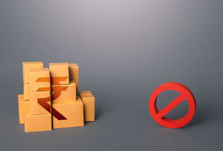 Indian rupee goods boxes and prohibition symbol NO. Ban on import goods. Impossibility of transportation, oversupply. Sanctions and embargoes. Shortage of goods. Confiscation of contraband. trade warsの写真素材