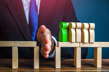 A corrupt official creates an artificial barrier. Conservatism, stopping progress. Difficulties and created problems. Save from failure. Conflict with superiors. Stop a competitor. unfair competitionの写真素材