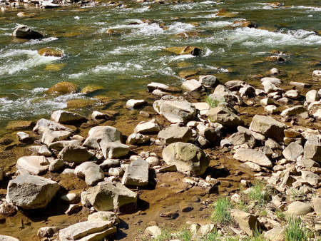 Spring view of flowing Prut river in Yaremche in Carpathian region in Ukraine. selective focus