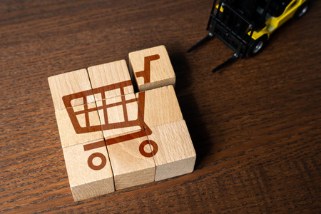 A forklift picks up goods in a shopping cart. The concept of organizing retail trade and delivery logistics. big sale. Best special offers on the market. Marketing, loyalty programs and discounts.の写真素材