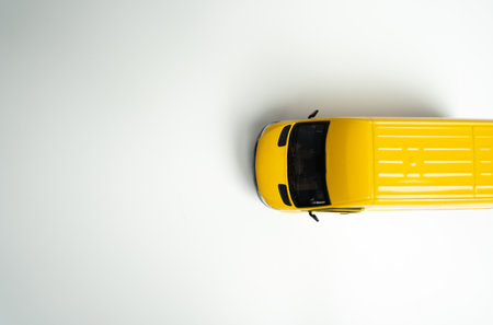 Yellow delivery van. Efficiency, speed, and reliability in transportation and logistics. E-commerce, retail, or other industries on efficient distribution networks. Delivering goods and servicesの写真素材