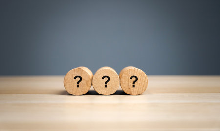 Wooden blocks with a question mark. Asking questions, searching for truth. Riddle mystery, investigation and research. FAQ - frequently asked questions. Search for information. Q&Aの写真素材