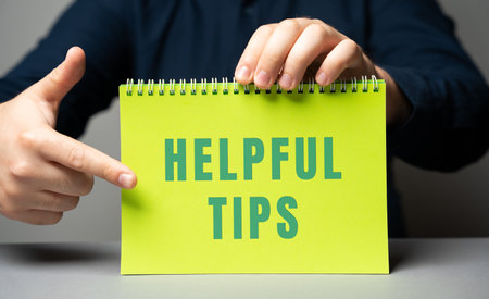Helpful tips on notes in male hands. business concept. Strategy, plan, planning. useful tipsの写真素材