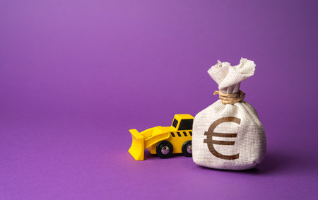 Bulldozer and euro money bag. Construction equipment rental. Demolition services, land leveling and other land works. Take down Illegal buildings. Industry machinery for rentの写真素材