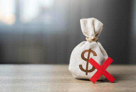 Dollar money bag and red X. Refusal to pay. Prohibition on payment. Prohibition on payments in dollars. Dedollarisation. Ban on dollars. Diversification foreign currencies exchange reserves.の写真素材