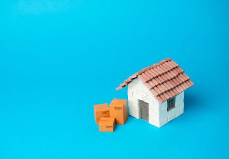 House and boxes. Home delivery of purchases. Home moving services. Online orders.の写真素材