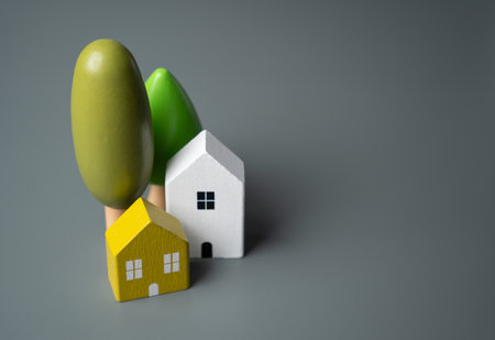 Houses and trees, figures. Country house. Environmental friendliness and autonomy of housing. High energy saving technologies, in harmony with nature. Villages and towns.の写真素材