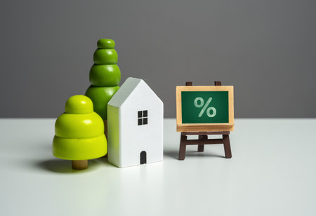 House and mortgage interest on sign. Buying a home on credit. Available loan terms and support programs.の写真素材