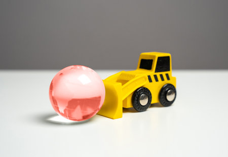 A bulldozer and a red globe symbolizing a world in crisis. Bad ecology. Human impact on the environment, prompting reflection on environmental concerns and the need for sustainable practices.の写真素材