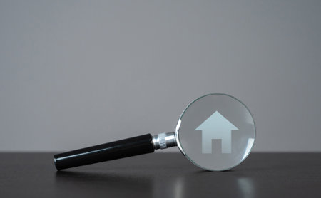 House and magnifying glass. Take a mortgage. Investments in immovable assets. Property Inspection before purchase to uncover any issues. Searching for real estate to buy. Find a suitable home.の写真素材