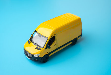 Yellow delivery van. Delivery of mail and cargo. Efficiency, speed, and reliability in transportation and logistics. Delivering goods and services. E-commerce, retail, or distribution networks.の写真素材