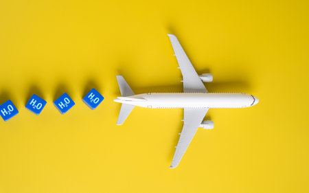 A hydrogen powered airline plane produces water vapor. Environmentally friendly aviation. Produce minimal emissions, significantly reducing the airplanes environmental impact. Future air travelの写真素材