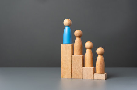 The leader and his team on the career ladder. Hierarchy. Achieve success. Group leader. Project manager. Discipline and teamwork. Leadership and personnel management. Distribution of inheritance.の写真素材