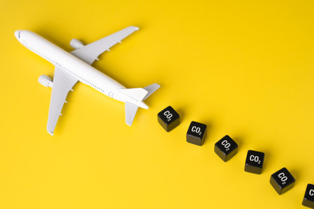 The plane leaves behind CO2 pollution. Quotas for greenhouse gas emissions. Environmental taxes. Assessing their environmental impact. Air quality concerns.の写真素材