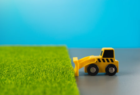Bulldozer clears fertile land for construction. Preservation of natural resources and agricultural...