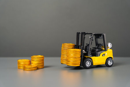 A forklift brings cash coins. Attracting investments. Brings profit and earnings. Injecting funds into the economy and industrial sector. Subsidization. Advantageous loans for industry and production.の写真素材