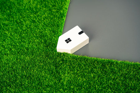 The house consumes natural lands. Development and growth of cities. Expansion of human settlements. Damage to nature. Regulation and environmental protection.の写真素材