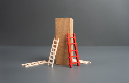 Attempts and ways to climb to the top of success. The concept of trying, failing and experimenting until you find the best way to achieve your goal. Advertising, marketing and targeting.の写真素材