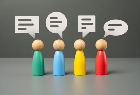 People communicate. Figures of people and speech bubbles. Unity and teamwork. Contact, communication. Exchange of opinions and experiences.の写真素材
