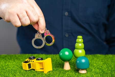 Man prevents deforestation, concept. Stop the forest from being cut down. Save nature. Protection of natural conservation areas. Deforestation. Arrest for damaging nature.の写真素材