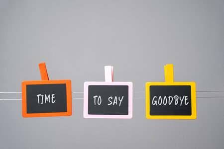 Inscription Time to say goodbye on wooden boards. Relations between people.の写真素材