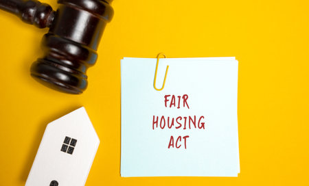 Notes Fair housing act, house and gavel. Law that prohibits discrimination in housing practices based on race, color, religion, sex, national origin, disability, or familial status. real estateの写真素材