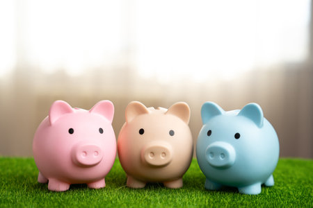 Three piggy banks stand together. Money and finance. Joint business, planning. Diversification of investments, multiple bank accounts. Savings.の写真素材
