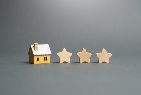 Residential building and three stars. Rating of housing for rent or purchase. Popularity and cost. Demand for real estate.の写真素材