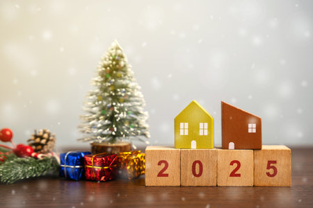 Wooden blocks 2025, Christmas tree and gifts with houses. Merry Christmas and Happy New Year! Xmas...