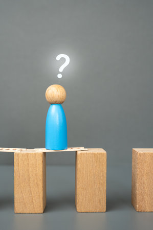 The blue man is wondering how to continue his journey and how to overcome the gap. The concept of finding innovative solutions. Problem-solving, adaptability, and pursuit of progressの写真素材