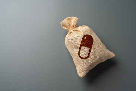 Bag with a picture of a medicine capsule. Medicines and drugs. Socially accessible drugs paid for by insurance or the state. Pharmaceutical aid programs. Healthcare support.の写真素材
