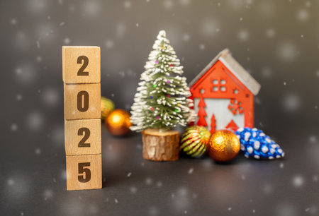 Blocks, Christmas tree and red house. Merry Christmas and Happy New Year! Xmas concept. Festive winter holiday. Snowfallの写真素材