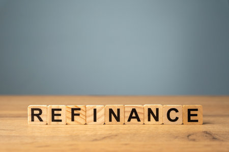 Blocks with the description Refinance. Process of replacing an existing loan with a new one, to secure better terms such as a lower interest rate or reduced monthly paymentsの写真素材