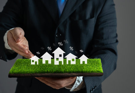 Businessman offers mortgage loans for the purchase of houses. Real estate developer. Home buying. Loan approval, and banking services.の写真素材