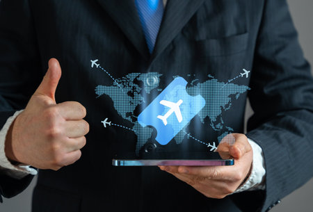Businessman booking air tickets. Flight booking purchase services. Business trips. Flight schedules management. Online travel reservations.の写真素材