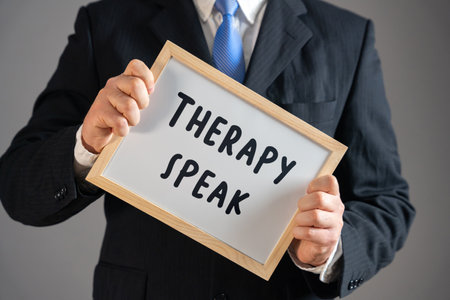 A businessman holds a Therapy Speak sign. Workplace well-being. Mental health awareness, professional dialogue trends. Corporate communication, emotional intelligence,の写真素材