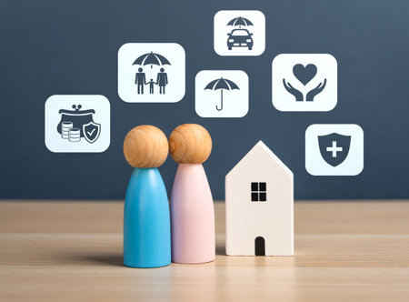 Insurance services and figures of a married couple with a house. Family protection, home insurance, financial security, life coverage, and risk management.の写真素材