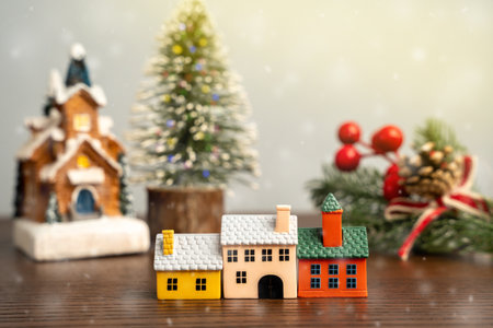 Miniature houses and Christmas trees. Merry Christmas and Happy New Year! Festive preparing for the xmas holidays. Town, city, real estate concept.の写真素材