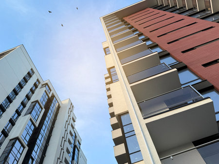 View of multi-storey buildings in a modern residential complex on a sunny day a blue sky background. Skyscrapers and real estateの写真素材